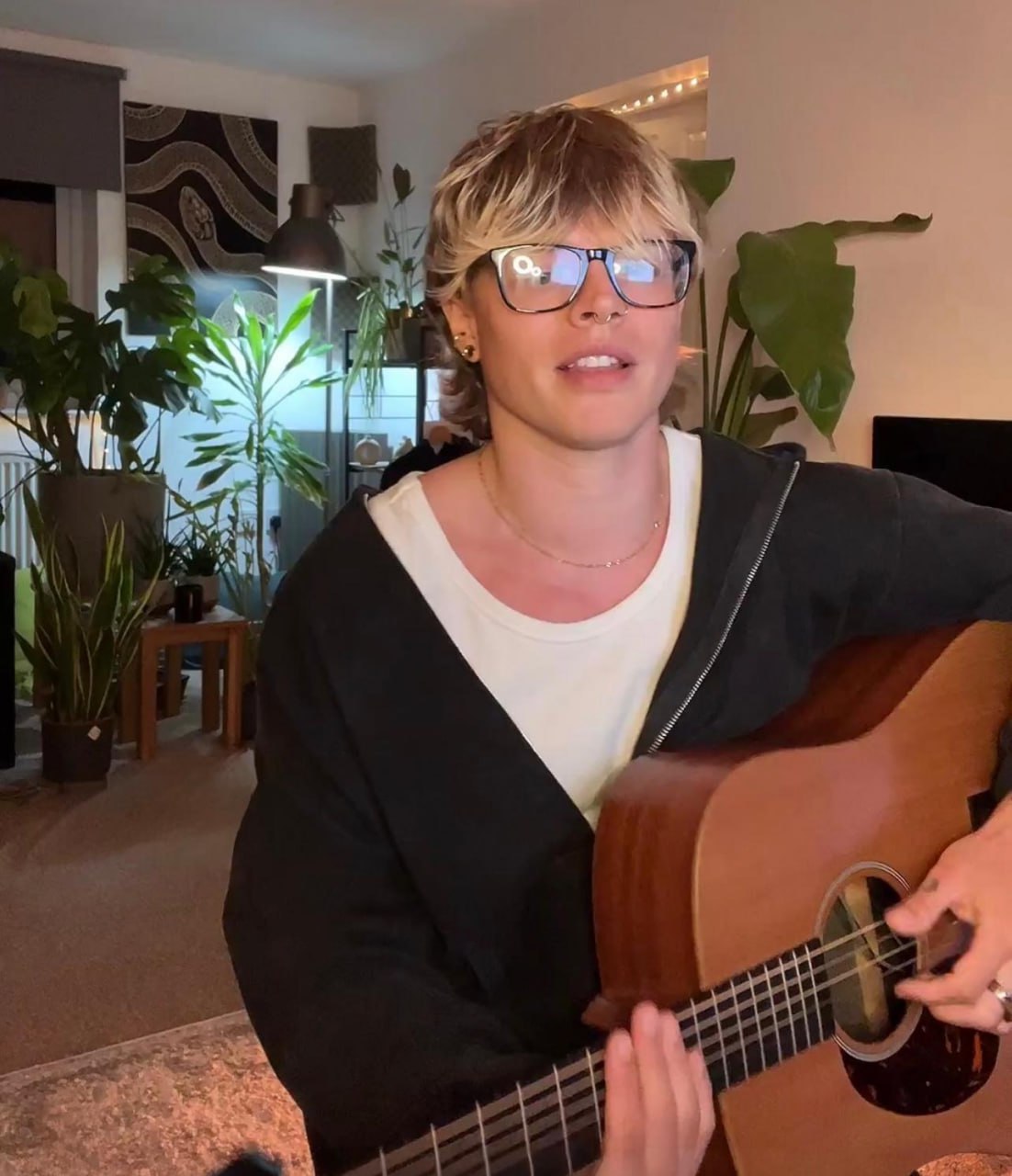 Seb Sanders playing acoustic guitar